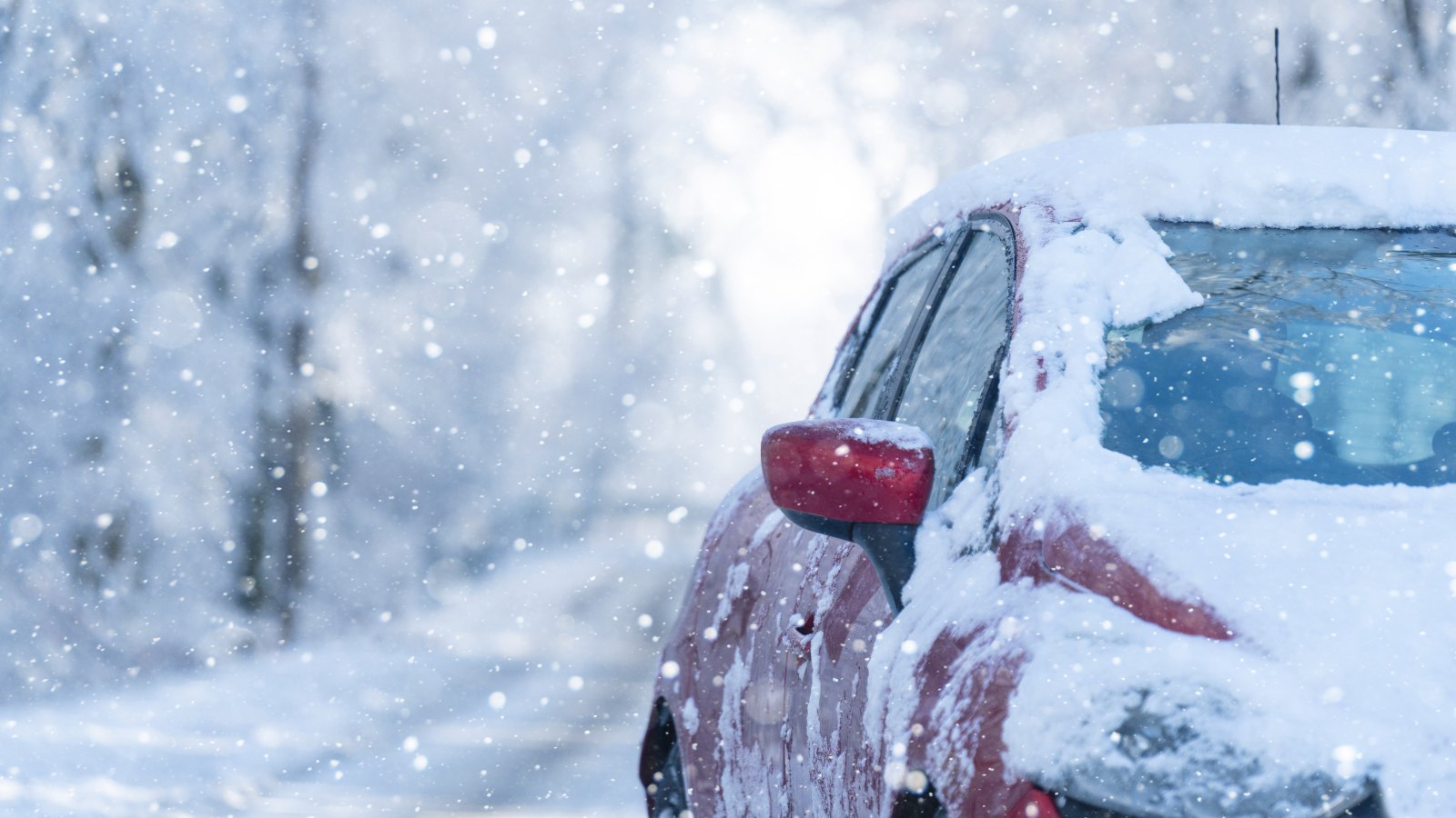 A rental car with snow on in a Norwegian winter.