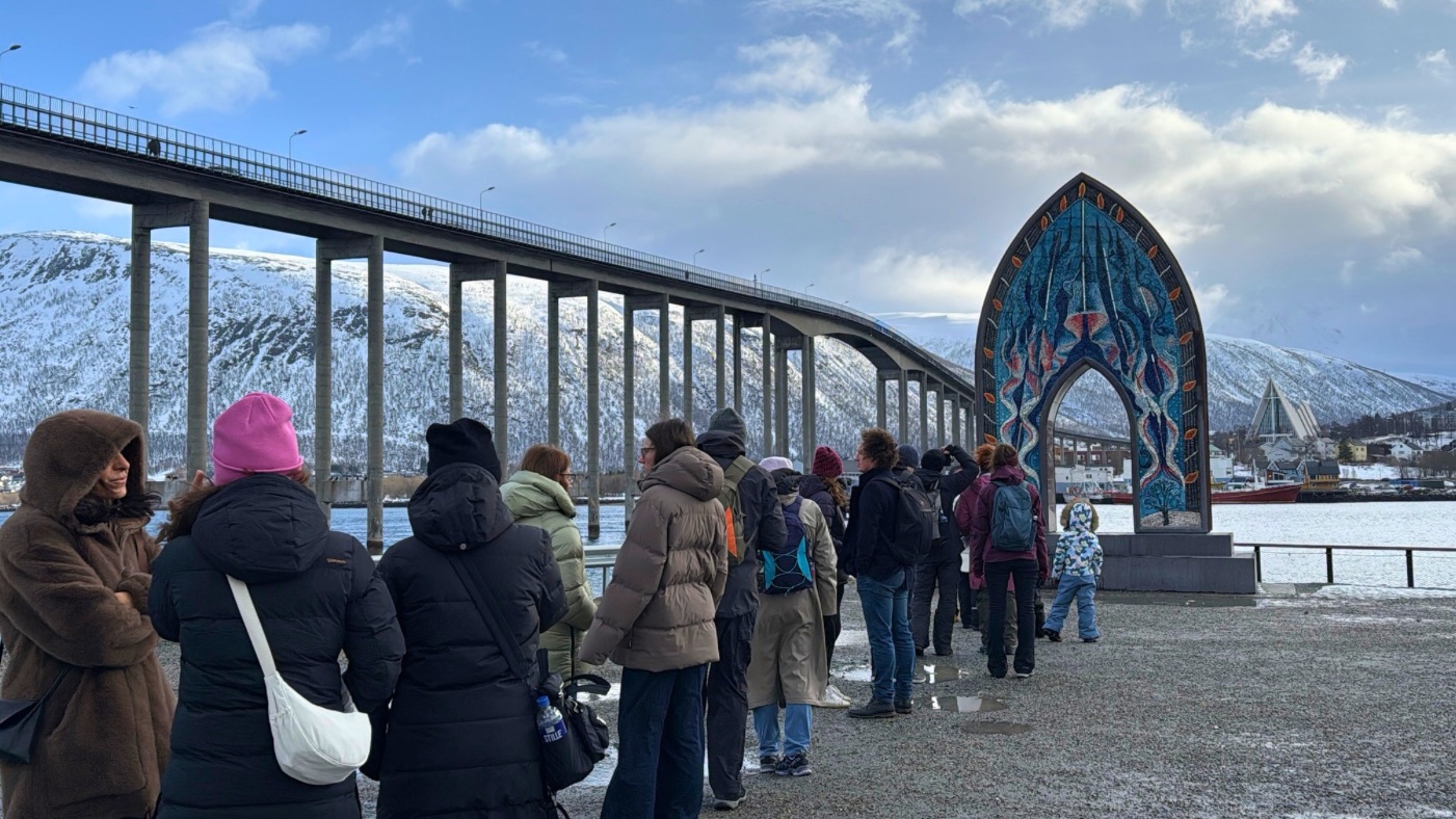 Tourists queueing for photographs at a Tromsø landmark. Photo: David Nikel.