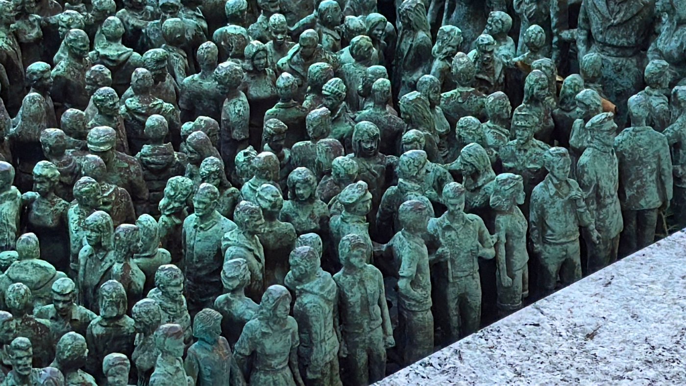 Tiny green people making up the sculpture